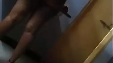 Hot figure standing topless in front of mirror