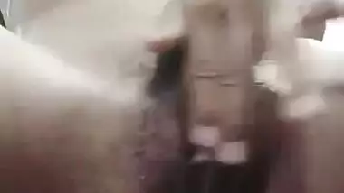 Horny teen Desi girl fingering naked pussy