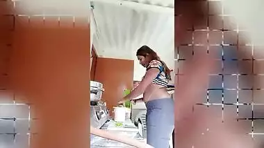Chubby Desi gal while cooking can barely hide her perky XXX boobs