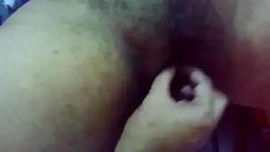 Hairy wife spreading legs to get fingered