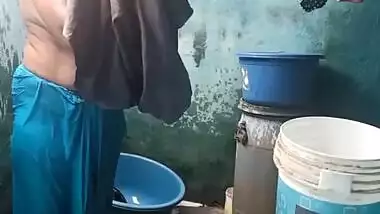 Mature topless village aunty bathing caught on cam