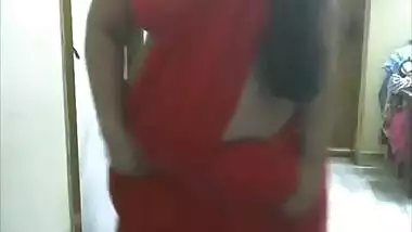 Horny desi bhabi showing boobs and fingering pussy in red saree