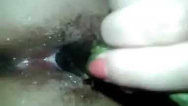 Hot Indian wife Binitha taking veggie in her pussy
