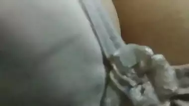Homemade porn by Indian man uncovering and playing with wife's boobs